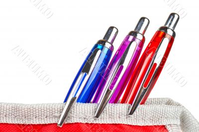 Three pens in a pencil case