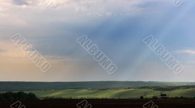 Sun beams through clouds.