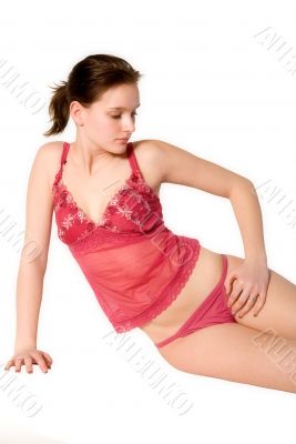 Woman in red lingerie sitting