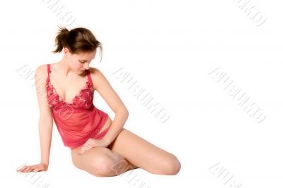 Woman in red lingerie looking down