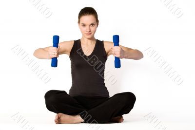Young girl is concentrating on weights