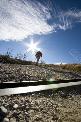 Man hiking up hills