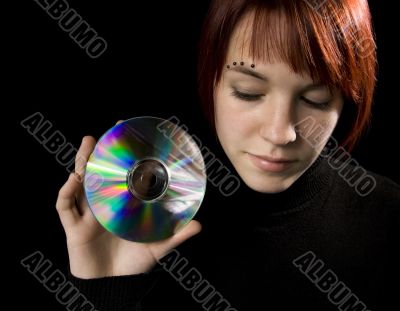 Girl holding a compact disc