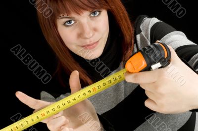 Girl using a measuring tape tool