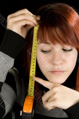 Girl pointing at a measuring tool