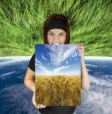 Angry girl holding a nature canvas