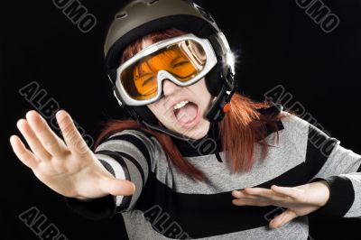 Girl wearing a ski helmet and googles
