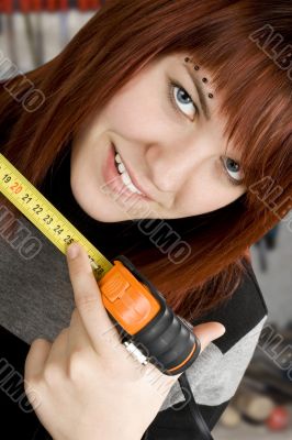 Girl using measuring tape