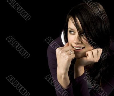 Seductive girl checking out someone and biting nails
