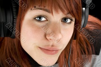 Seductive girl listening to music