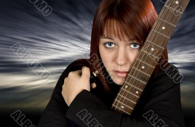 Sad girl protecting her guitar