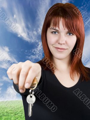 Redhead girl passing keys