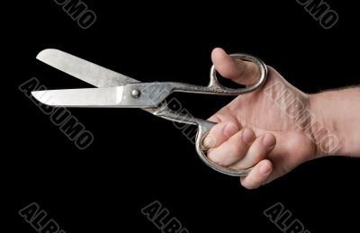 Scissors in a hand