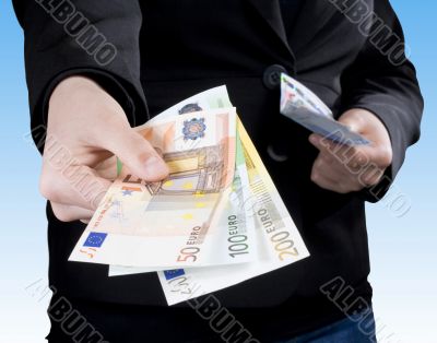 Hand passing Euro banknote money