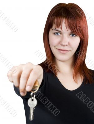 Redhead girl passing keys
