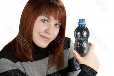 Redhead girl holding water bottle