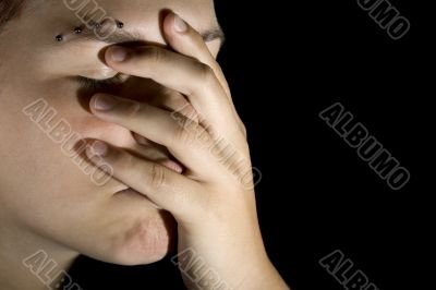 Sad girl with hand on her face