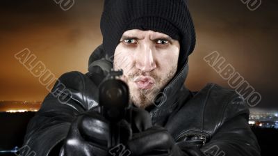 Undercover agent firing gun in the camera