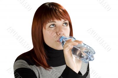 Redhead girl drinking water