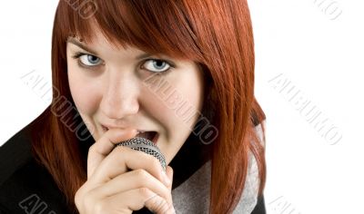 Girl singing karaoke on microphone