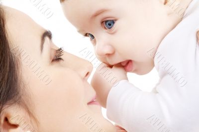happy mother playing with baby boy 2