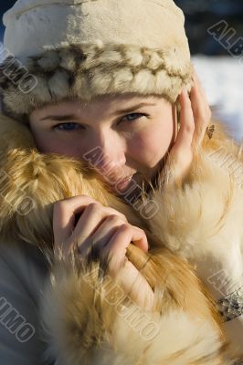 Young beautiful girl on the nature close up.