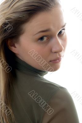 Portrait of the young beautiful girl on a white background. Stud