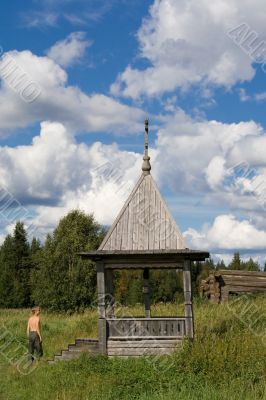 student and wooden chapel