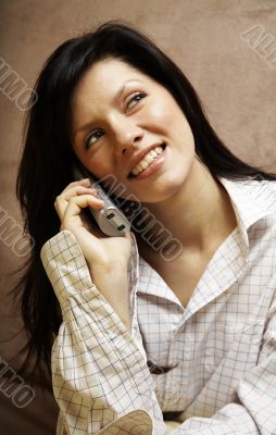 young woman is speaking on cell phone