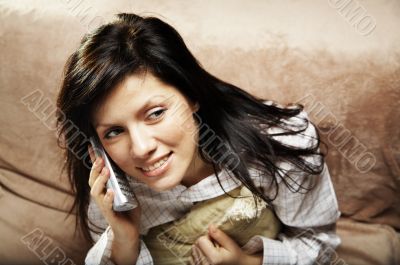 young woman is speaking on cell phone