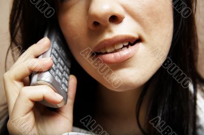 young woman is speaking on cell phone