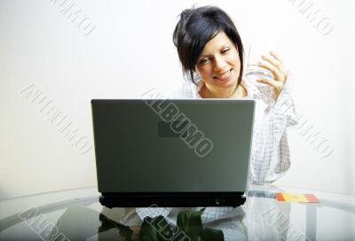 beautiful woman with laptop in mens shirt