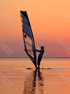 Silhouette of a wind-surfer on a sunset 3