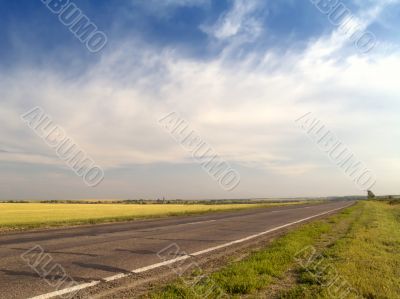 Asphalt road with drammatic sky
