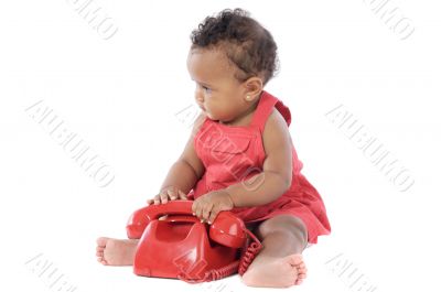 Baby with red phone