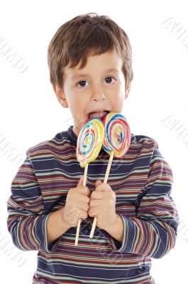 Child eating two lollipops
