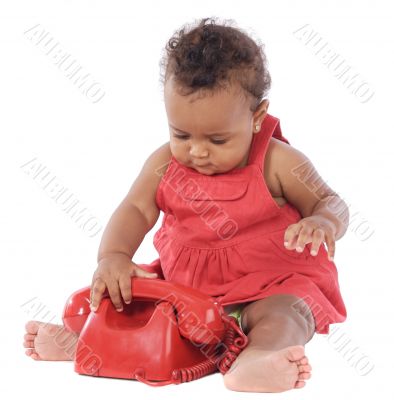 Baby with red phone