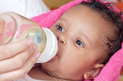 Baby drinking a bottle