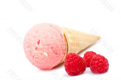 Strawberry ice cream cone with raspberries