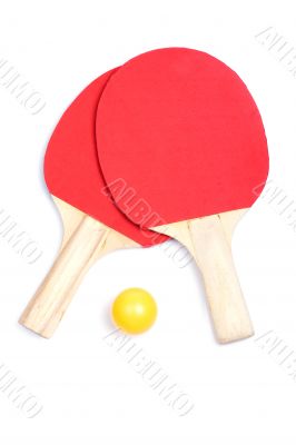Ping pong paddles and yellow ball