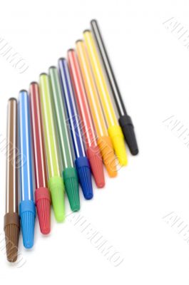 colored markers on white background