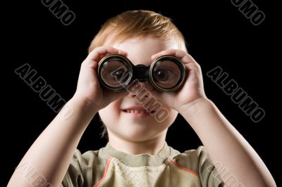 The child watching with binoculars.