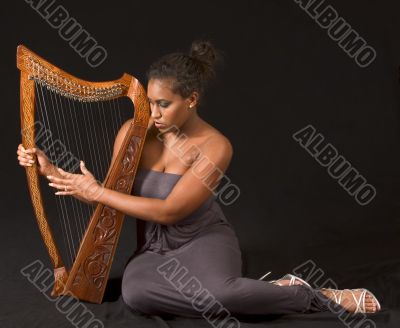 African-American woman with harp