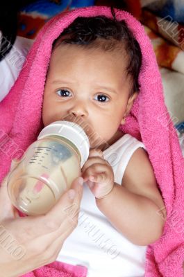 Baby drinking a bottle