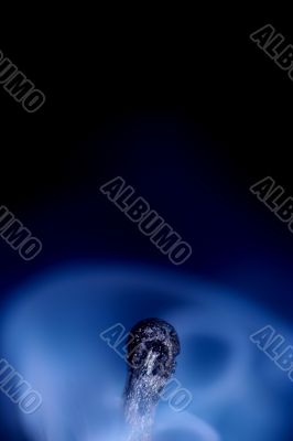 Match with smoke isolated in dark background