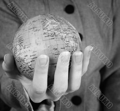 Globe in a girl`s hands