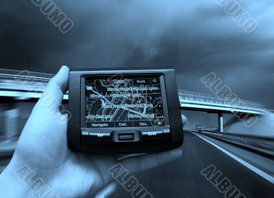 GPS Vehicle navigation system in a man hand.