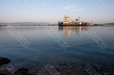 ship swiming up to the river