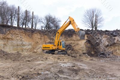 Yellow excavator at work