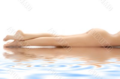 long legs of relaxed lady in water